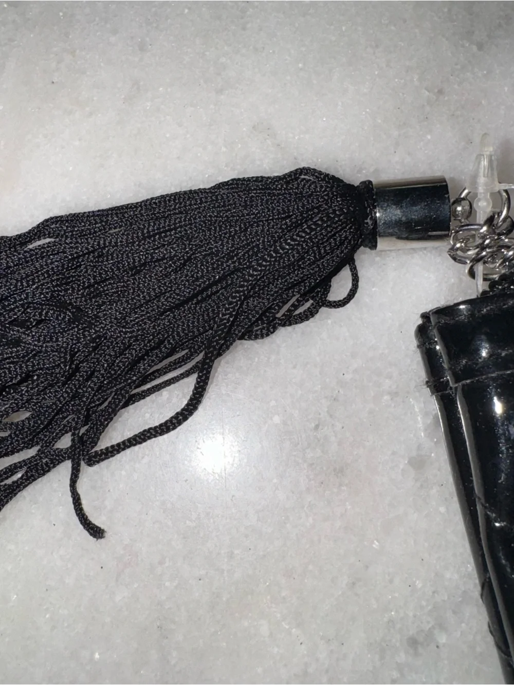 Shiny black quilted cosmetics bag